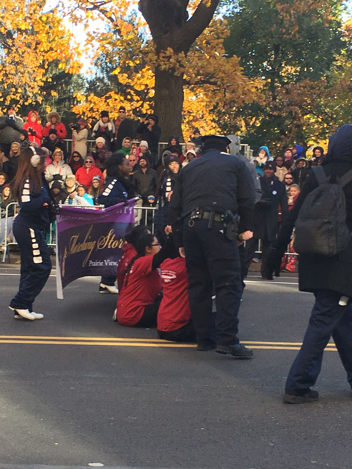 PHOTO: The protesters sat in the middle of Central Park West at 70th Street and momentarily delayed the parade before they were carried off by NYPD police officers.