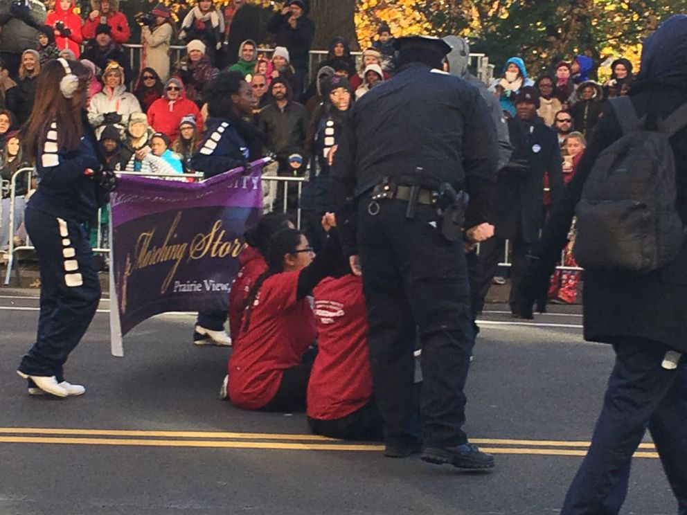 PHOTO: The protesters sat in the middle of Central Park West at 70th Street and momentarily delayed the parade before they were carried off by NYPD police officers.