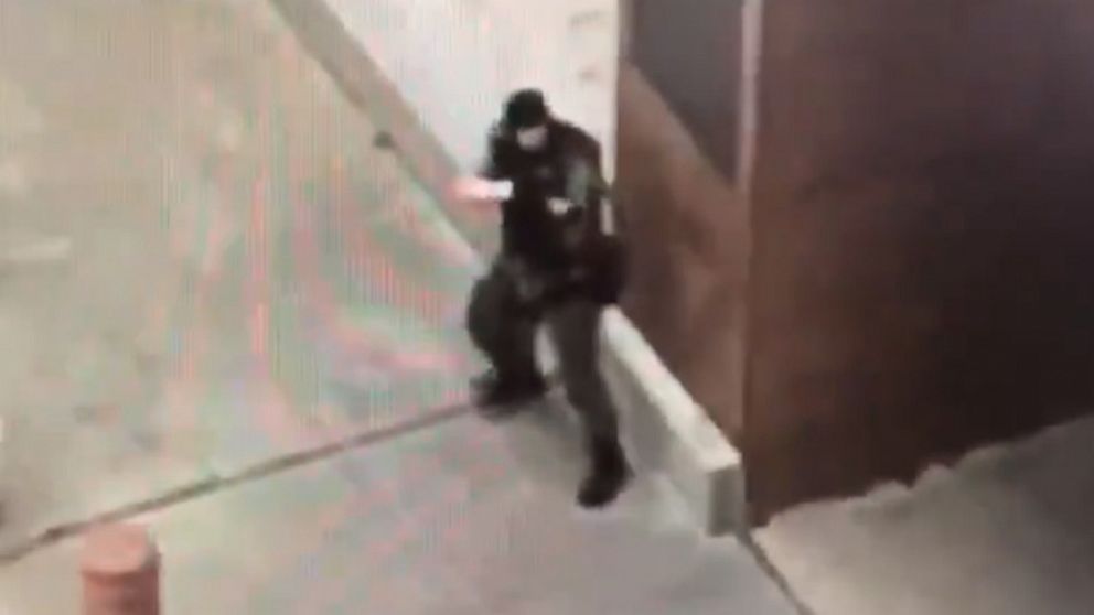 PHOTO: Cell-phone video taken by a witness appears to show a gunman dressed in tactical gear firing an assault rifle outside the Earle Cabell federal courthouse in Dallas on June 17, 2019.