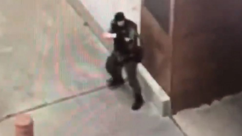 PHOTO: Cell-phone video taken by a witness appears to show a gunman dressed in tactical gear firing an assault rifle outside the Earle Cabell federal courthouse in Dallas on June 17, 2019.