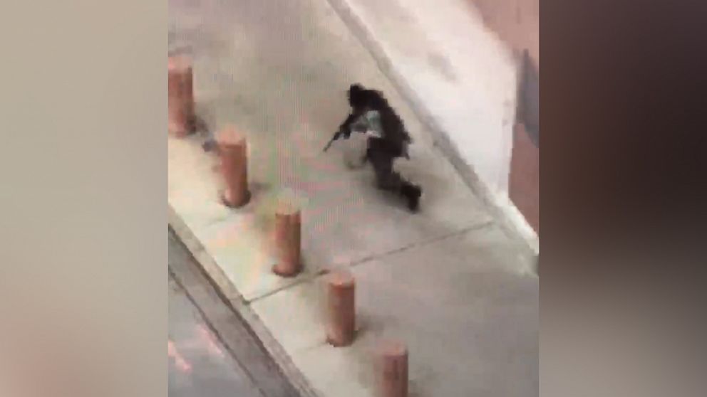 PHOTO: Cell-phone video taken by a witness appears to show a gunman dressed in tactical gear firing an assault rifle outside the Earle Cabell federal courthouse in Dallas on June 17, 2019.