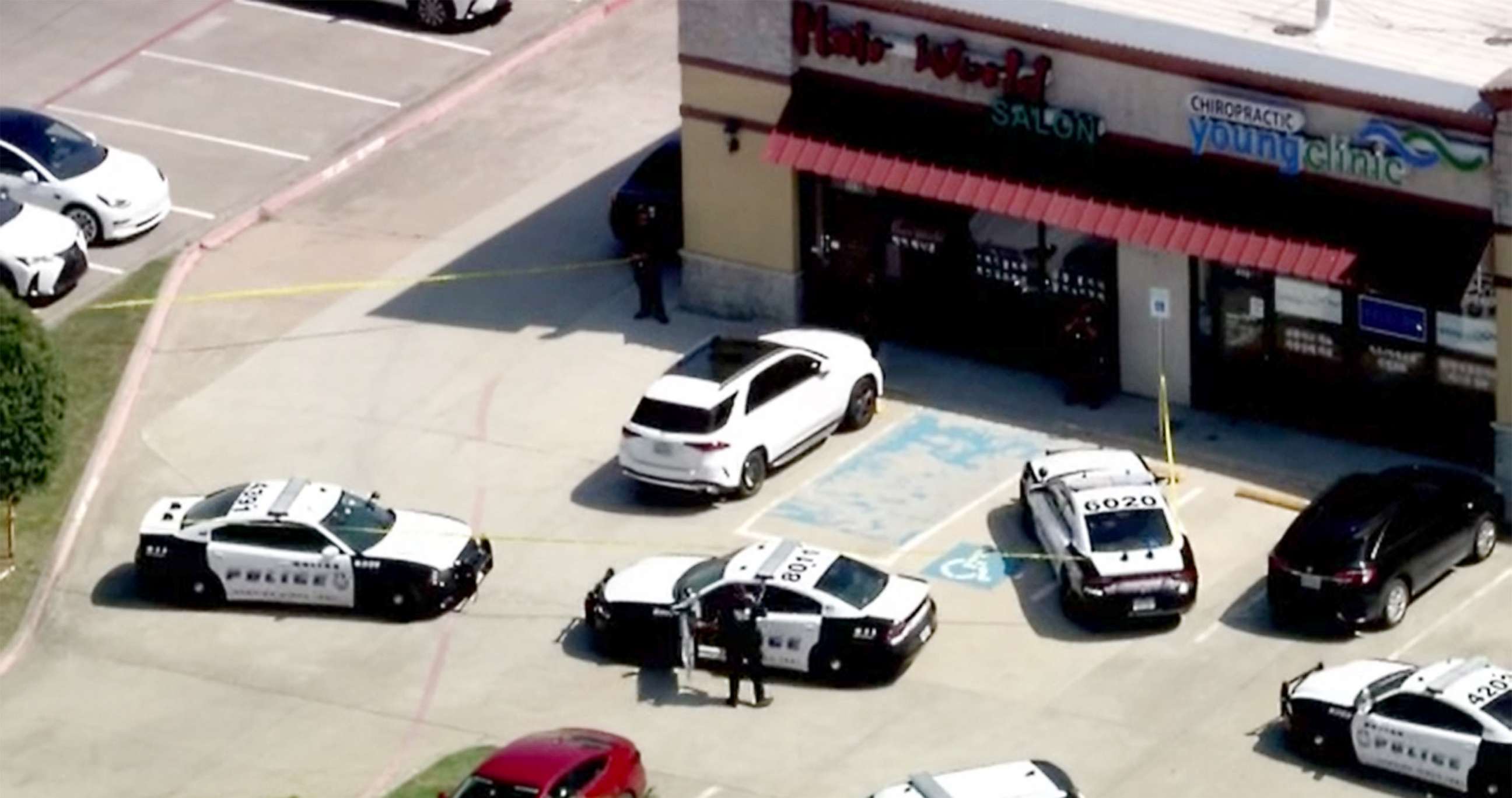 PHOTO: Police respond to the scene of a shooting at a salon in Dallas, May 11, 2022.