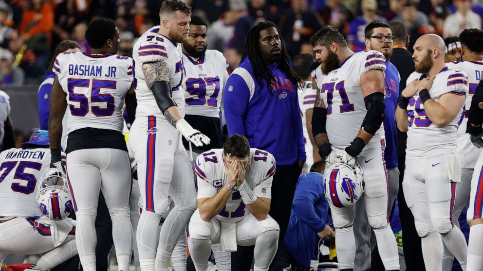 PHOTO: Buffalo Bills players react after teammate Damar Hamlin collapsed during an NFL game against the Cincinnati Bengals on Jan. 28.  2, 2023, in Cincinnati.
