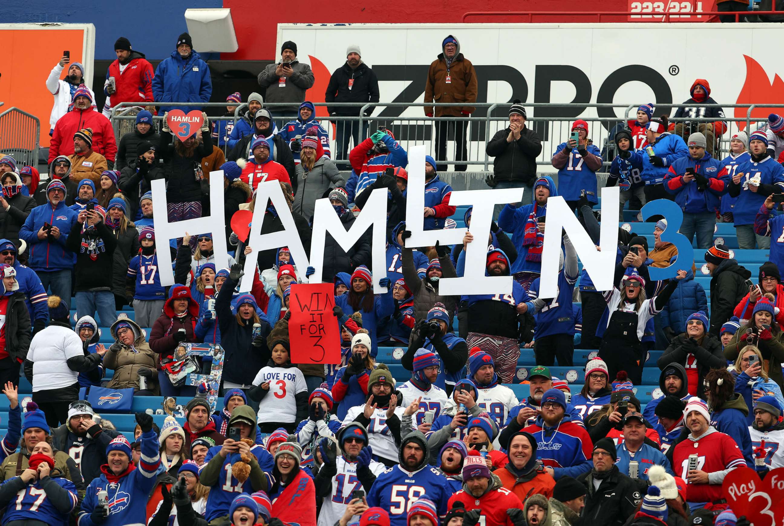 PHOTO: Buffalo Bills fans hold signs in support of Buffalo Bills safety Damar Hamlin prior to the game against the New England Patriots at Highmark Stadium, Jan. 08, 2023 in Orchard Park, New York.
