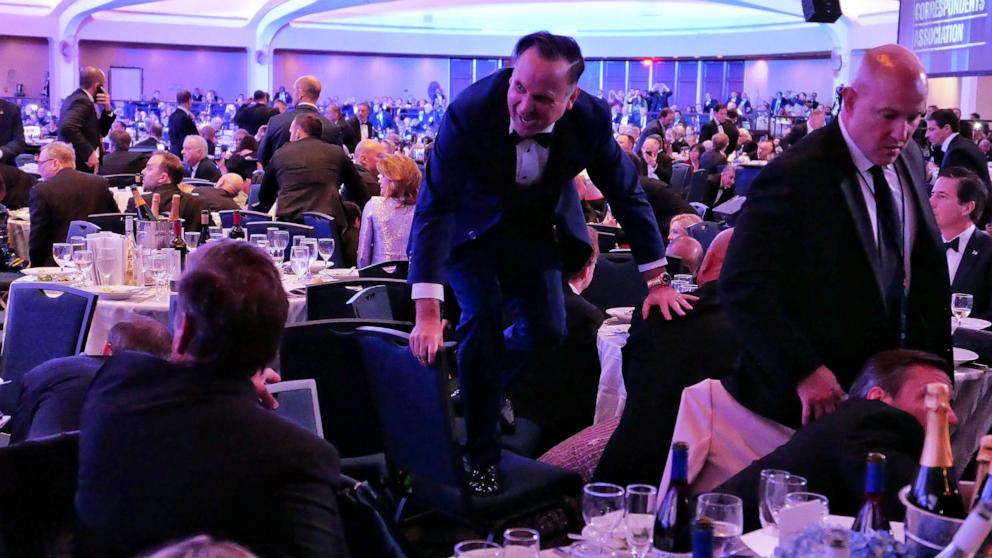 PHOTO: Dan Scavino jumps over a chair after an incident at the annual White House Correspondents Association Dinner, April 25, 2026 in Washington.
