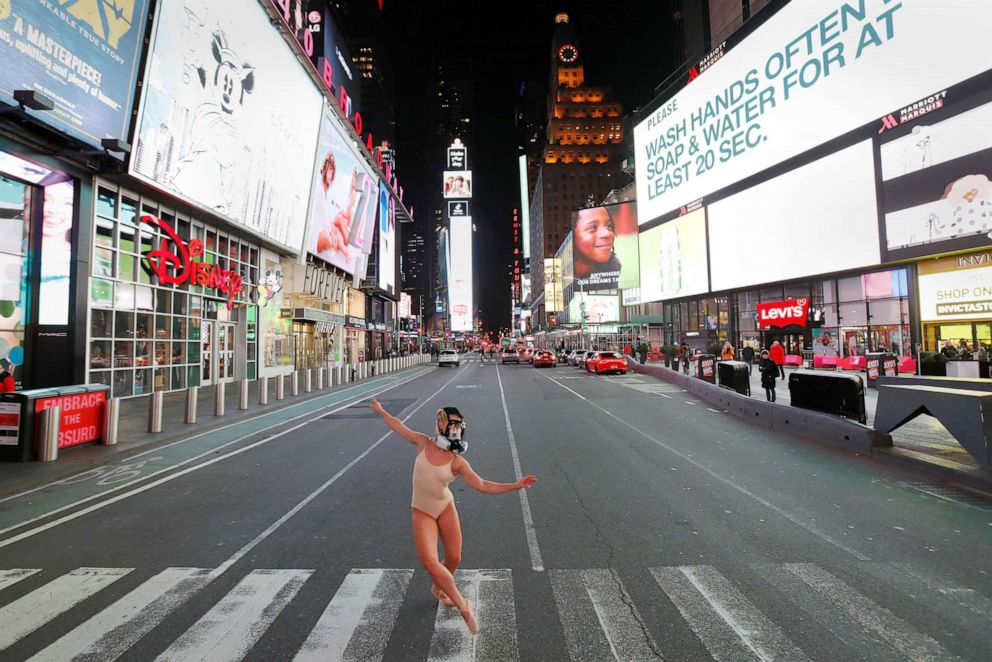 PHOTO: Ballet dancer and performer Ashlee Montague of New York wears a gas mask while she dances in Times Square as the coronavirus disease (COVID-19) outbreak continued in New York City, March 18, 2020.
