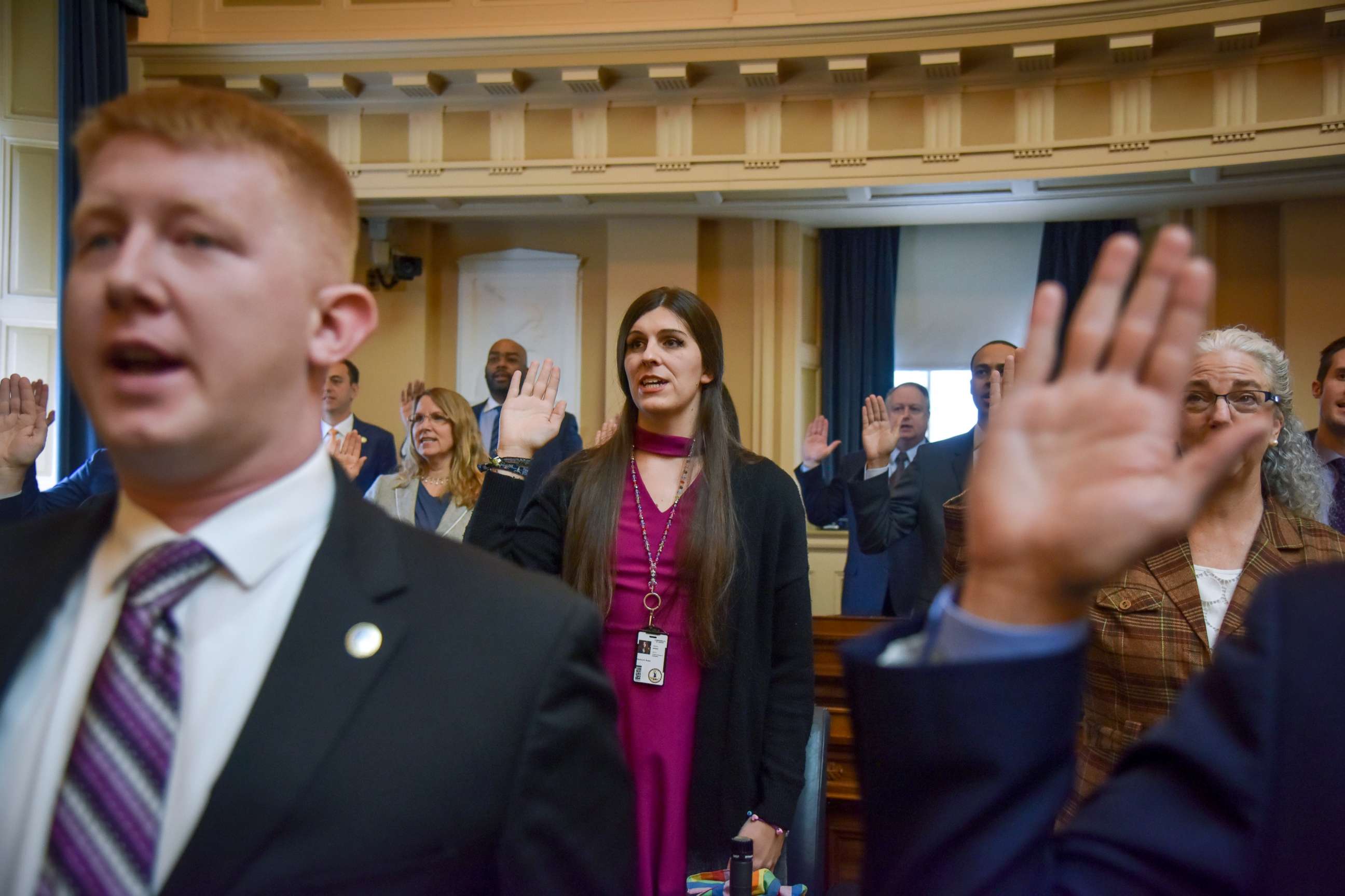 PHOTO: Delegate Danica Roem, center, and other delegates are sworn in on the floor of the House of Delegates at the Virginia State Capitol, Jan. 10, 2018, in Richmond, VA.
