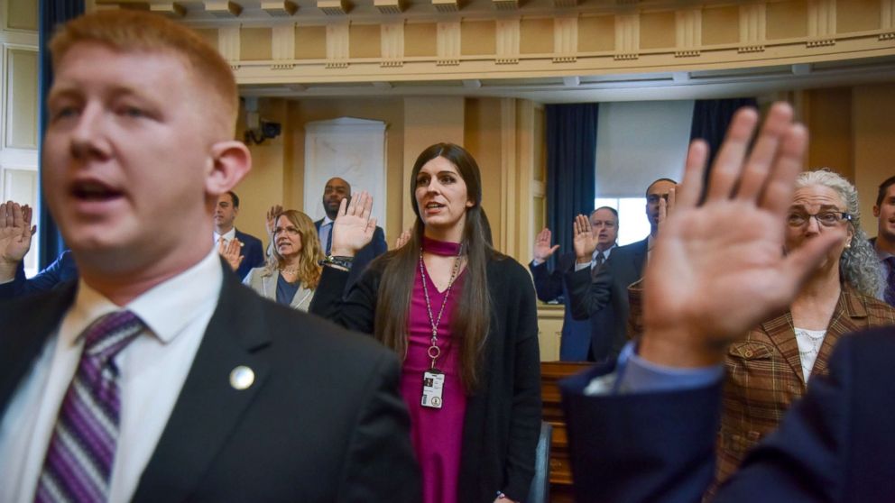 PHOTO: Delegate Danica Roem, center, and other delegates are sworn in on the floor of the House of Delegates at the Virginia State Capitol, Jan. 10, 2018, in Richmond, VA.