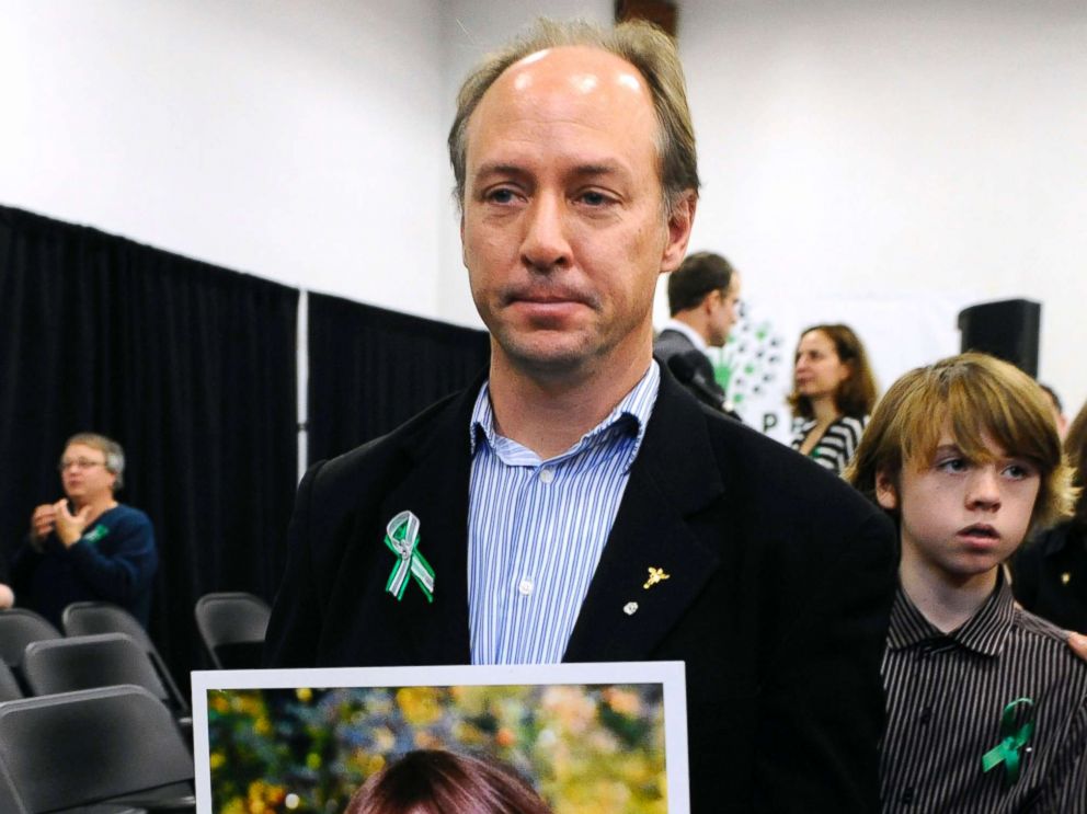 PHOTO: Mark Barden, father of Sandy Hook Elementary School shooting victim Daniel Barden holds a photograph of his son as he leaves a news conference at Edmond Town Hall in Newtown, Conn., Jan. 14, 2013.