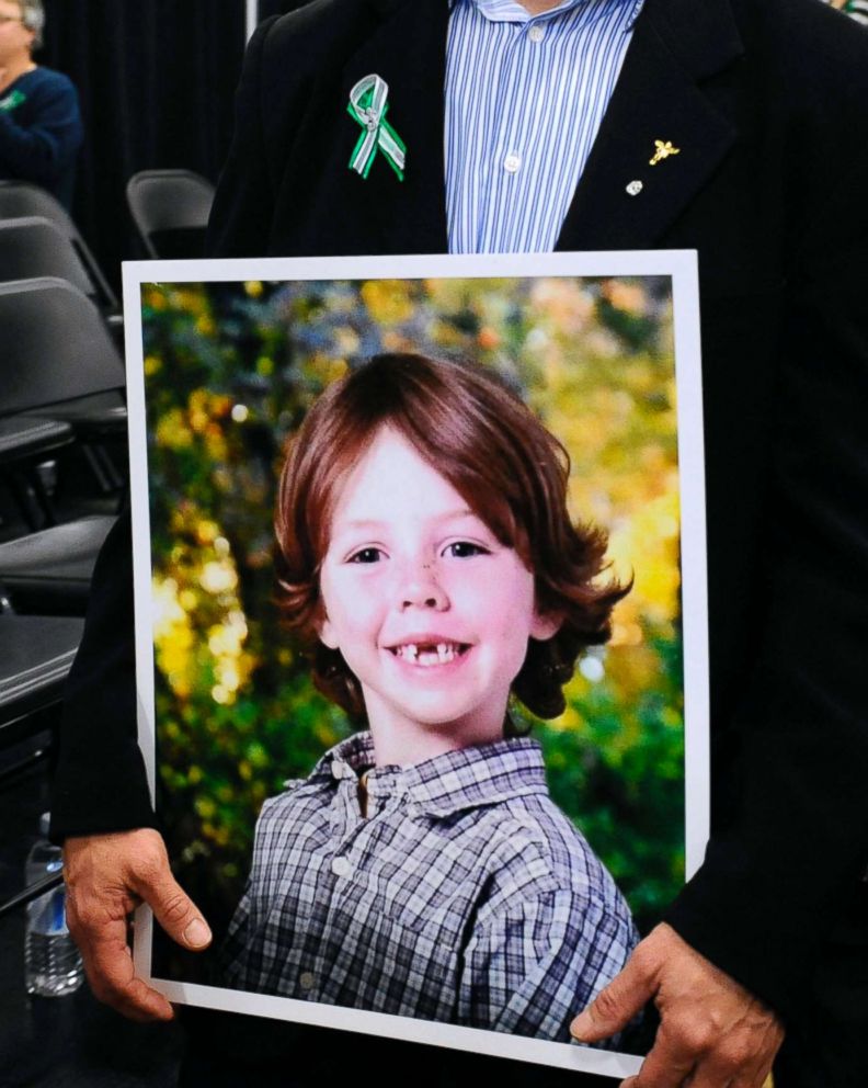 PHOTO: Mark Barden, father of Sandy Hook Elementary School shooting victim Daniel Barden holds a photograph of his son as he leaves a news conference at Edmond Town Hall in Newtown, Conn., Jan. 14, 2013.