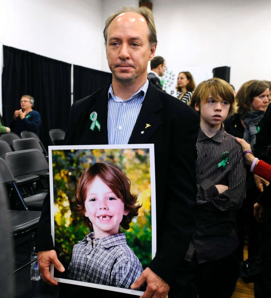 PHOTO: Mark Barden, father of Sandy Hook Elementary School shooting victim Daniel Barden holds a photograph of his son as he leaves a news conference at Edmond Town Hall in Newtown, Conn., Jan. 14, 2013.