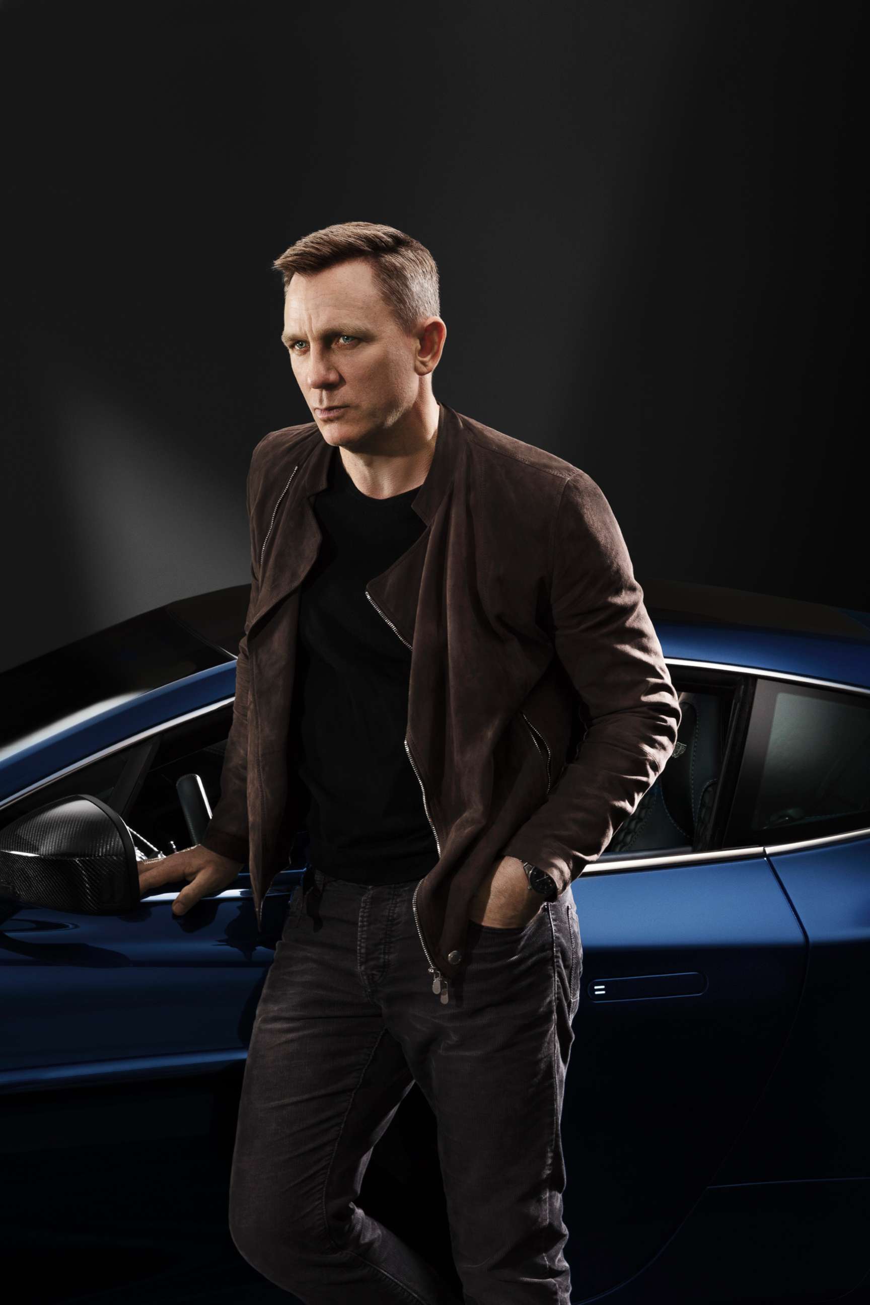 PHOTO: Daniel Craig is pictured with his limited edition Centennial Aston Martin Vanquish in an undated handout photo.
