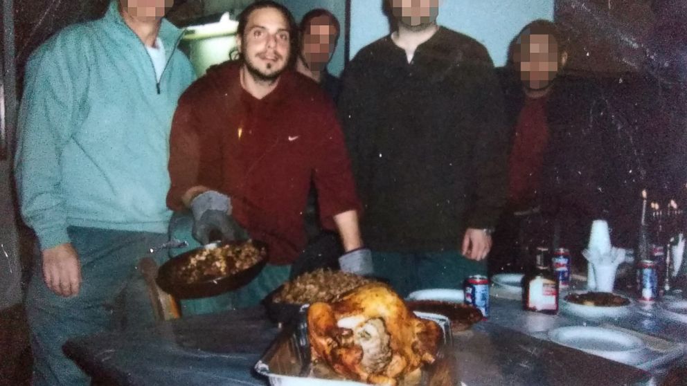 Daniel Genis and fellow inmates observe Thanksgiving with a turkey in prison in 2008.
