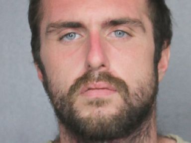 2 cops suspended after video shows them beating suspect