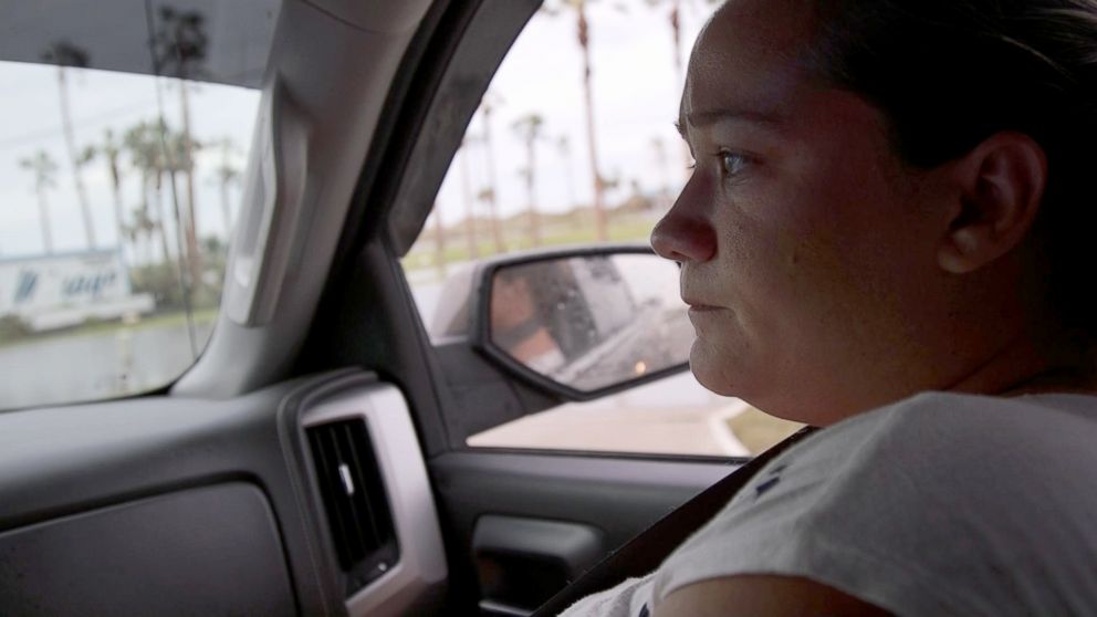 PHOTO: Danielle Weeks looks sadly out the window of her car after being told by authorities that there is an active search-and-rescue going on in Port Aransas, Texas and she and her family are not allowed to come into town limits to check on their home.
