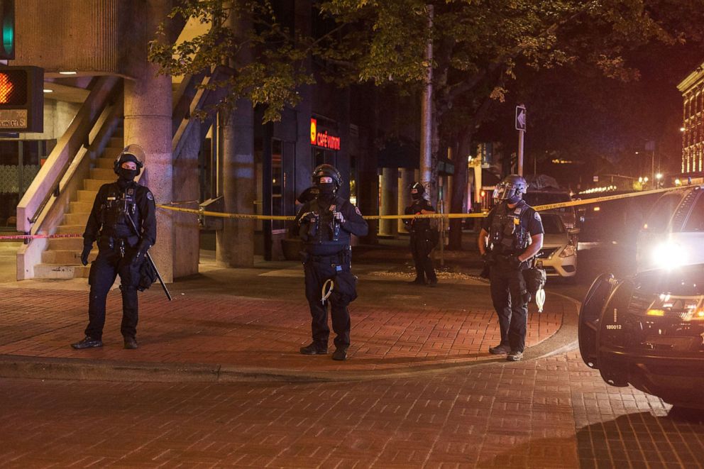 PHOTO: Police officers guard an area where Aaron Danielson was shot and killed at a protest in Portland, Ore., Aug. 29, 2020.