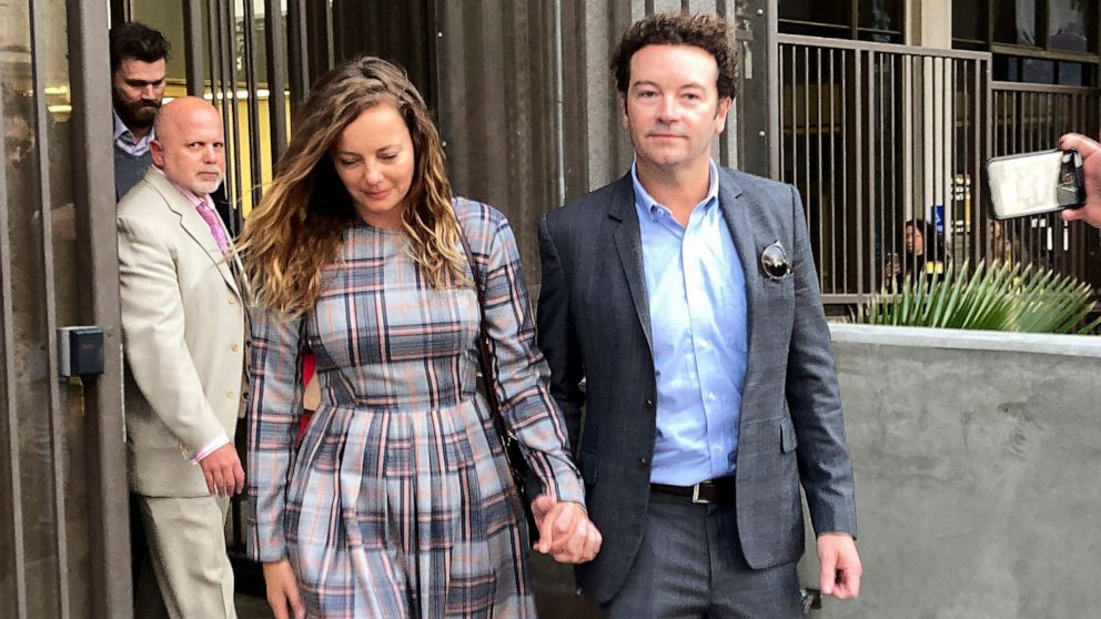 PHOTO:FILE - Actor Danny Masterson exits Los Angeles Superior Court with his wife Bijou Phillips after a judge declared a mistrial in his rape case on November 30, 2022 in Los Angeles.