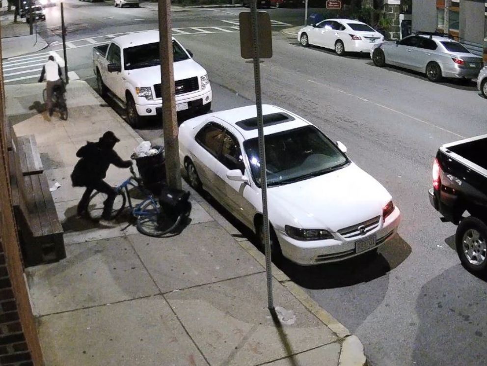 PHOTO: Surveillance video shows Danny Morris arriving at his market and confronting two robbers.