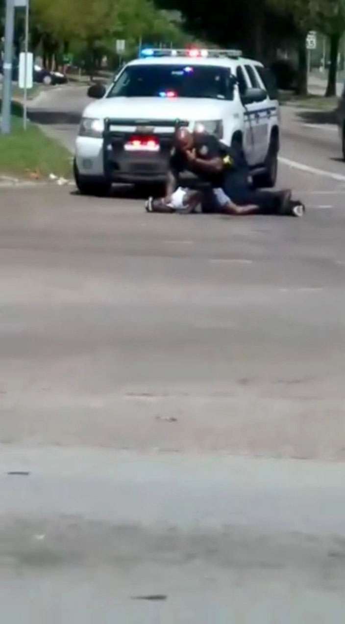 PHOTO: Danny Ray Thomas lies on the ground next to a sheriff's deputy after he was shot in Houston, Texas, March 22, 2018.