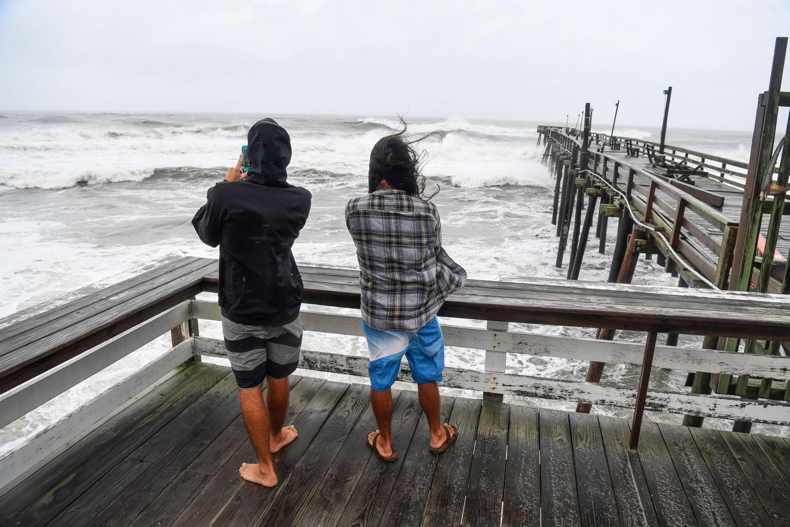 PHOTO: People venture out to the Rodanthe Pier in Rodanthe, N.C. on Hatteras Island in the Outer Banks on Sept. 6, 2019.

