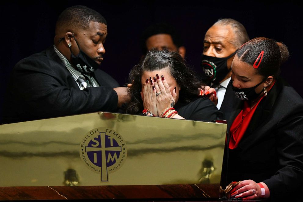 PHOTO: Father Arbuey Wright and mother Katie Wright give remarks alongside sister Diamond Wright and Rev Al Sharpton during a funeral held for Daunte Wright at Shiloh Temple International Ministries on April 22, 2021, in Minneapolis.