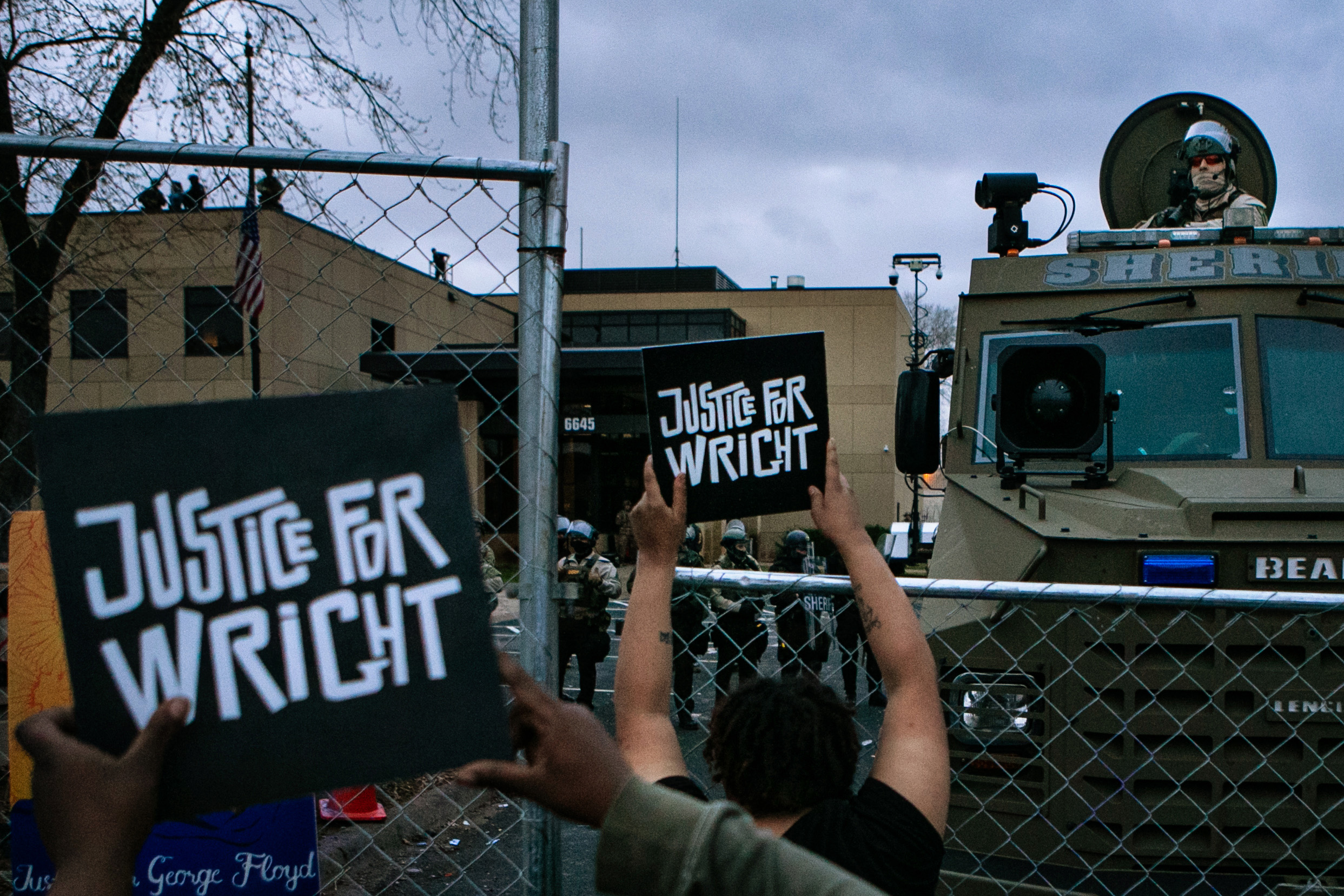 PHOTO: Protesters gather outside the Brooklyn Center Police Department calling for justice for Daunte Wright before curfew on April 14, 2021, in Brooklyn Center, Minn.