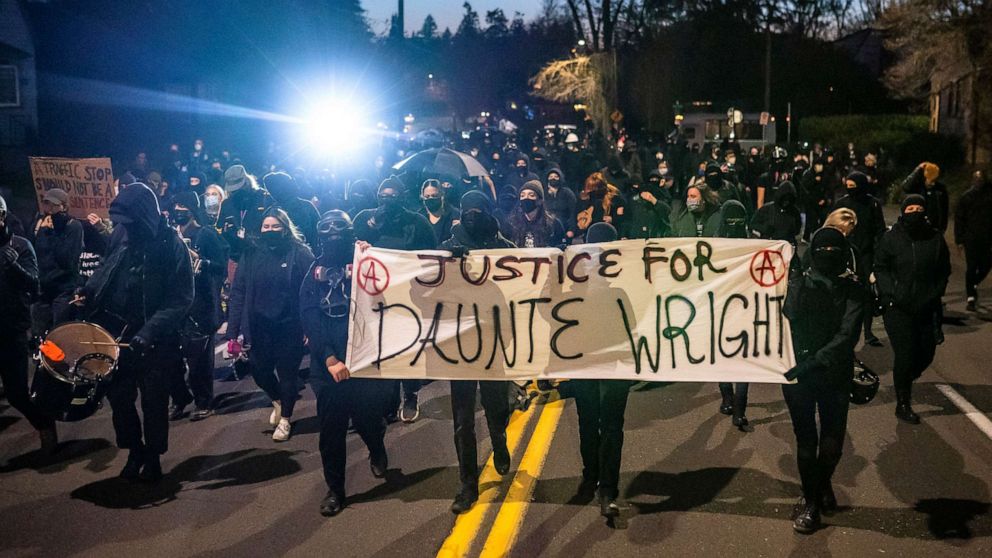 PHOTO: Activists march towards the Multnomah County Sheriff's office during a protest against the killing of Daunte Wright on April 12, 2021 in Portland, Ore.