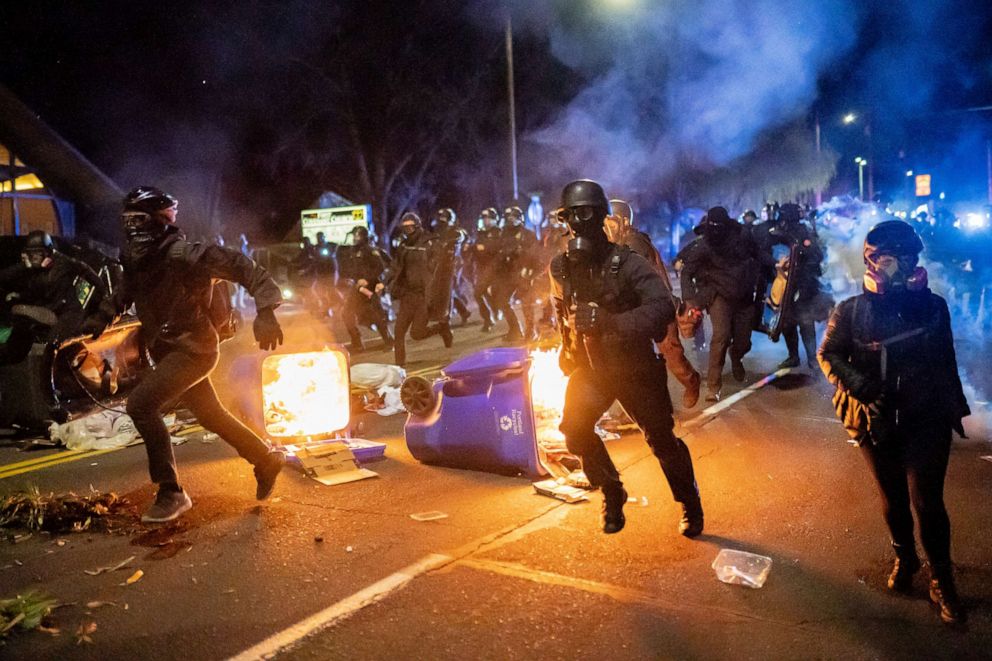 PHOTO: Police chase demonstrators after a riot was declared in Portland, Oregon, on April 12, 2021, during a protest against the killing of Daunte Wright, who was fatally shot by a police officer in Brooklyn Center, Minnesota.