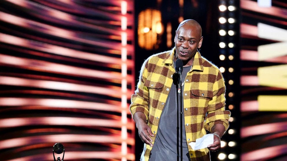 PHOTO: In this October 30, 2021, file photo, Dave Chappelle introduces Jay-Z during the Rock and Roll Hall of Fame induction ceremony in Cleveland, Ohio.