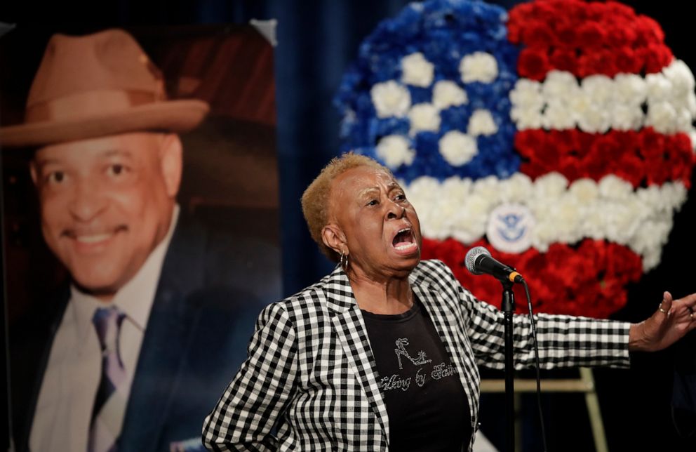 PHOTO: Janie Taylor sings beside a photo of Federal Protective Services Officer Dave Patrick Underwood on Friday, June 19, 2020, in Pinole, Calif.
