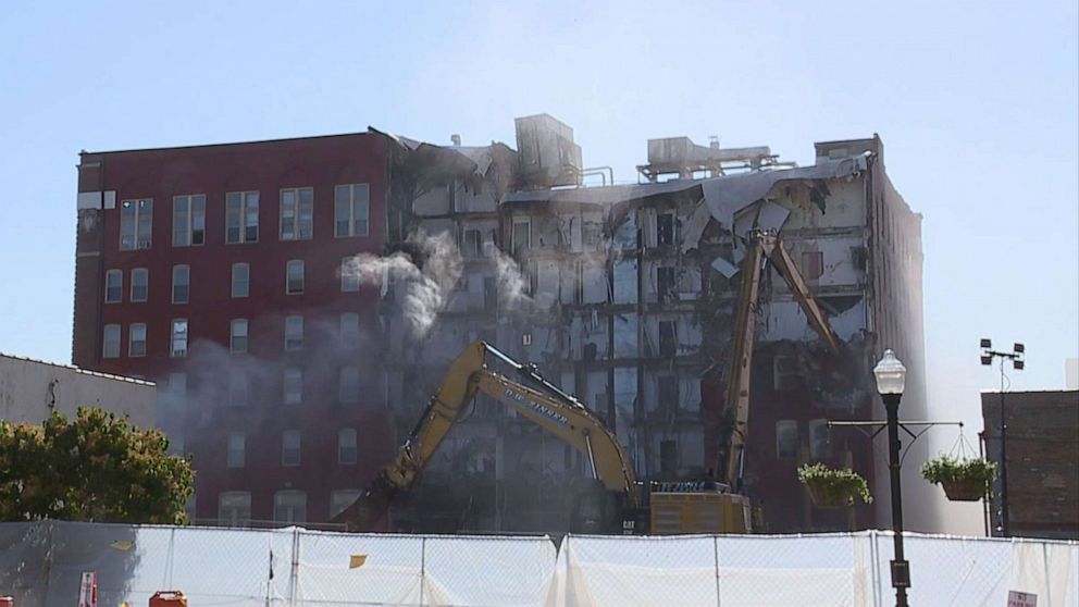 PHOTO: Demolition begins on the six-story apartment building, June 12, 2023, in Davenport, Iowa, after it partially collapsed on May 28.