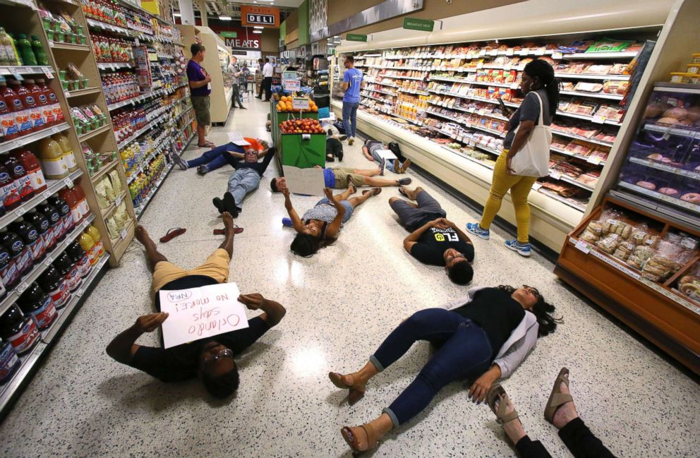 PHOTO: Demonstrators lie on the floor during a protest against gun violence, at the Publix store on East Colonial Drive near downtown Orlando, Fla., on May 25, 2018.