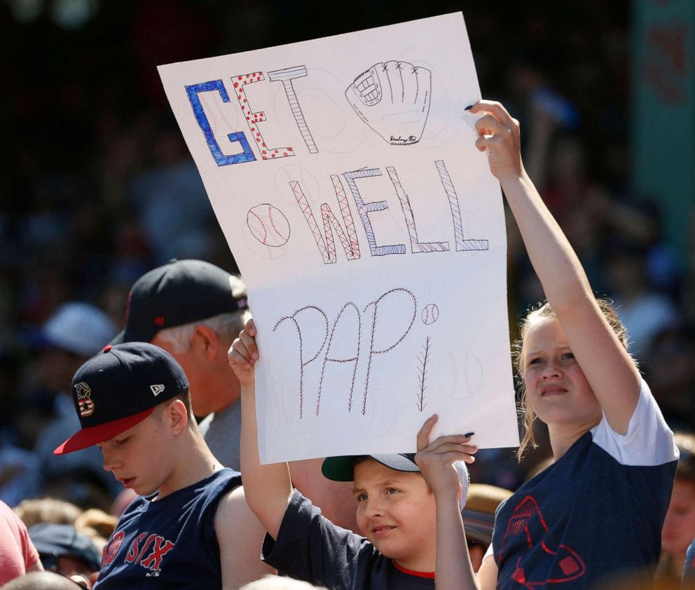 PHOTO: Boston Red Sox fans hold up a sign for Red Sox former player David Ortiz during the fourth inning of a game against the Chicago White Sox at Fenway Park, June, 26, 2019, in Boston.