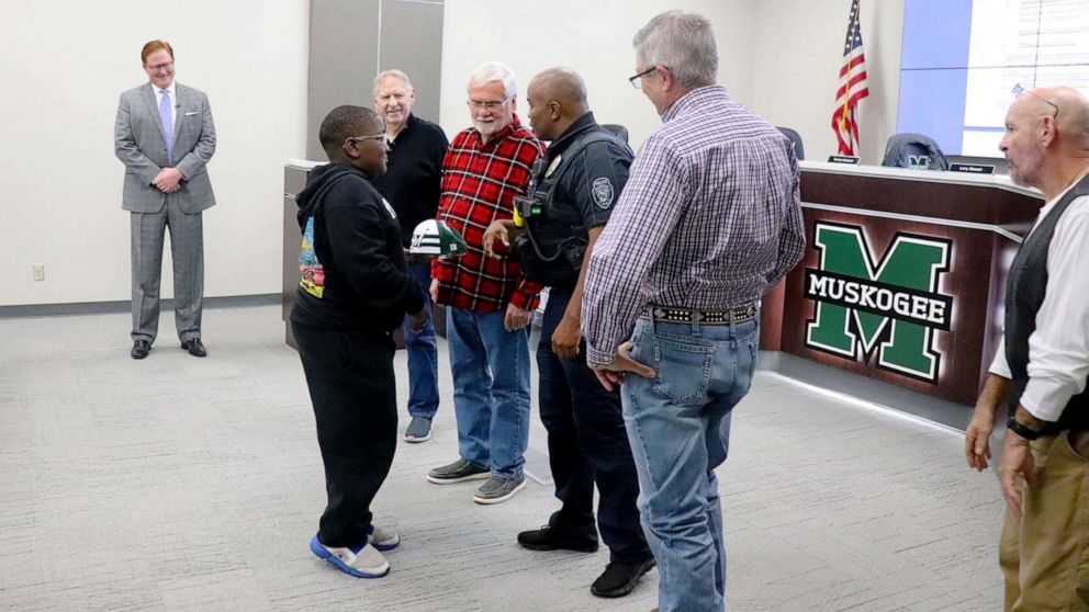 PHOTO: Sixth grader Davyon Johnson is honored Muskogee Public Schools, the Police Department, and the County Sheriff's Department in Muskogee, Okla., Dec. 14, 2021.