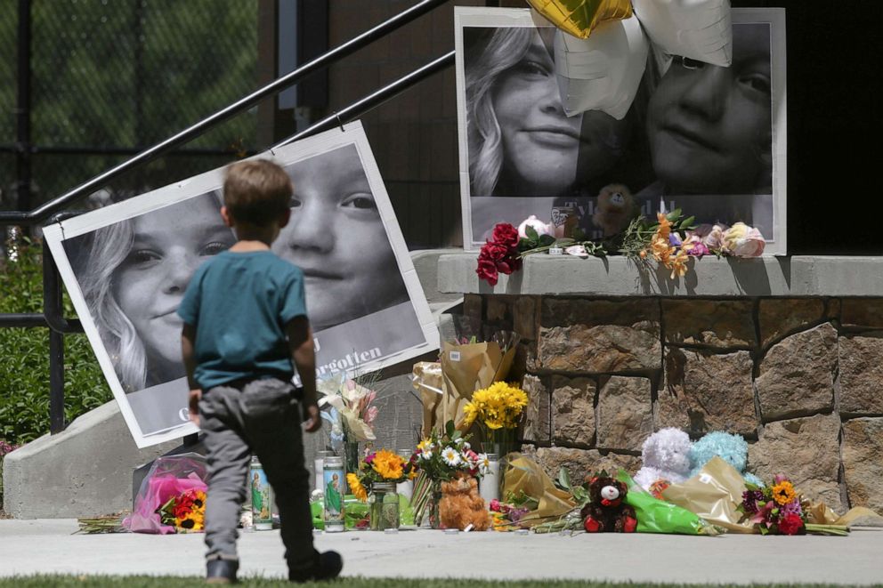 PHOTO: A boy looks at a memorial for Tylee Ryan, 17, and Joshua "JJ" Vallow, 7, at Porter Park in Rexburg, Idaho, June 11, 2020.