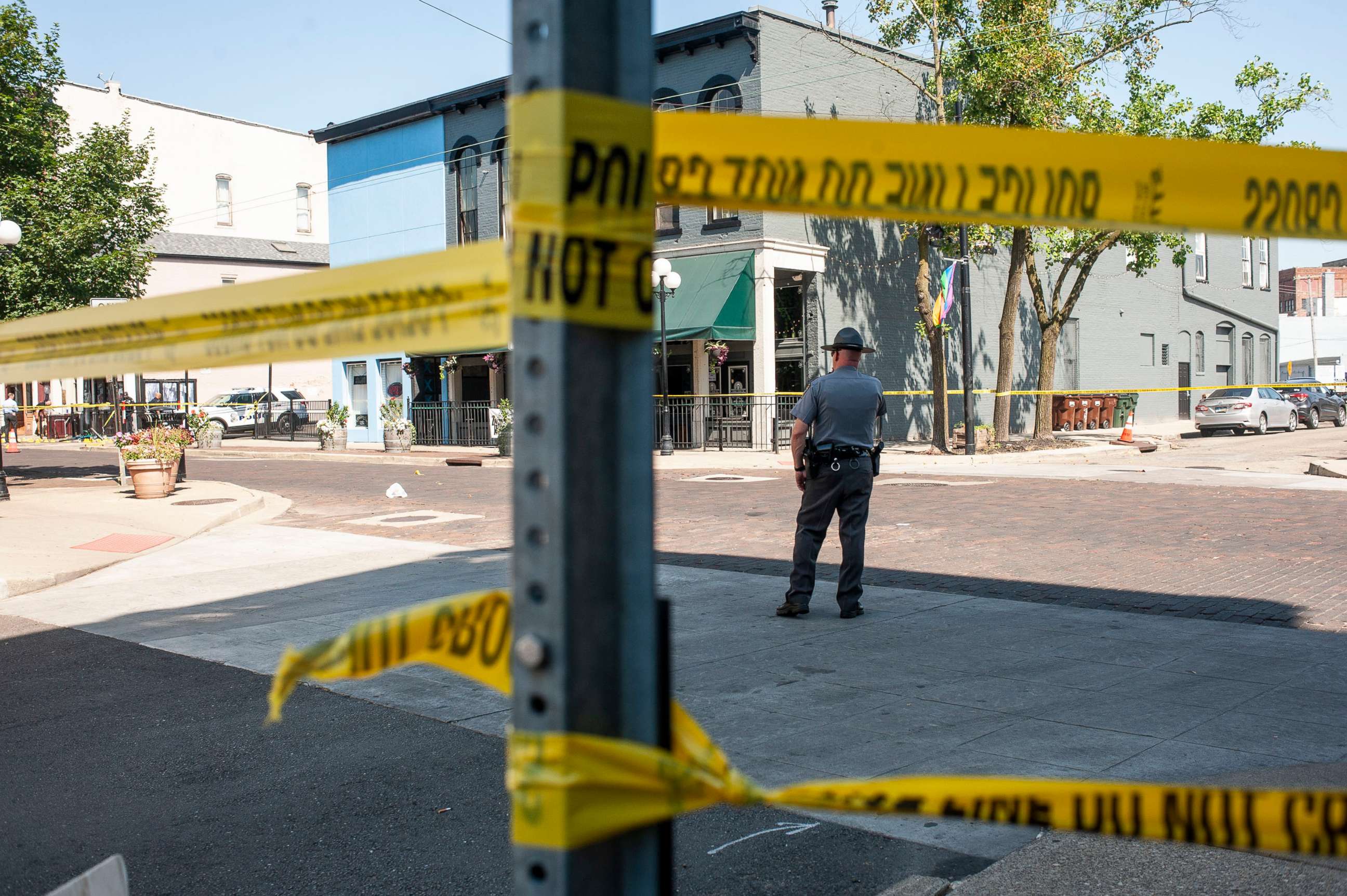 PHOTO: Law enforcement officials investigate the scene where a gunman opened fire on a crowd of people over night on Fifth Avenue, Aug. 4, 2019, in Dayton, Ohio. 