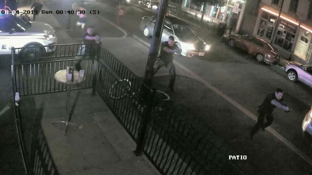 PHOTO: Police officers approach the scene of a mass shooting with weapons drawn in a still image from surveillance video released by police in Dayton, Ohio, Aug. 4, 2019.