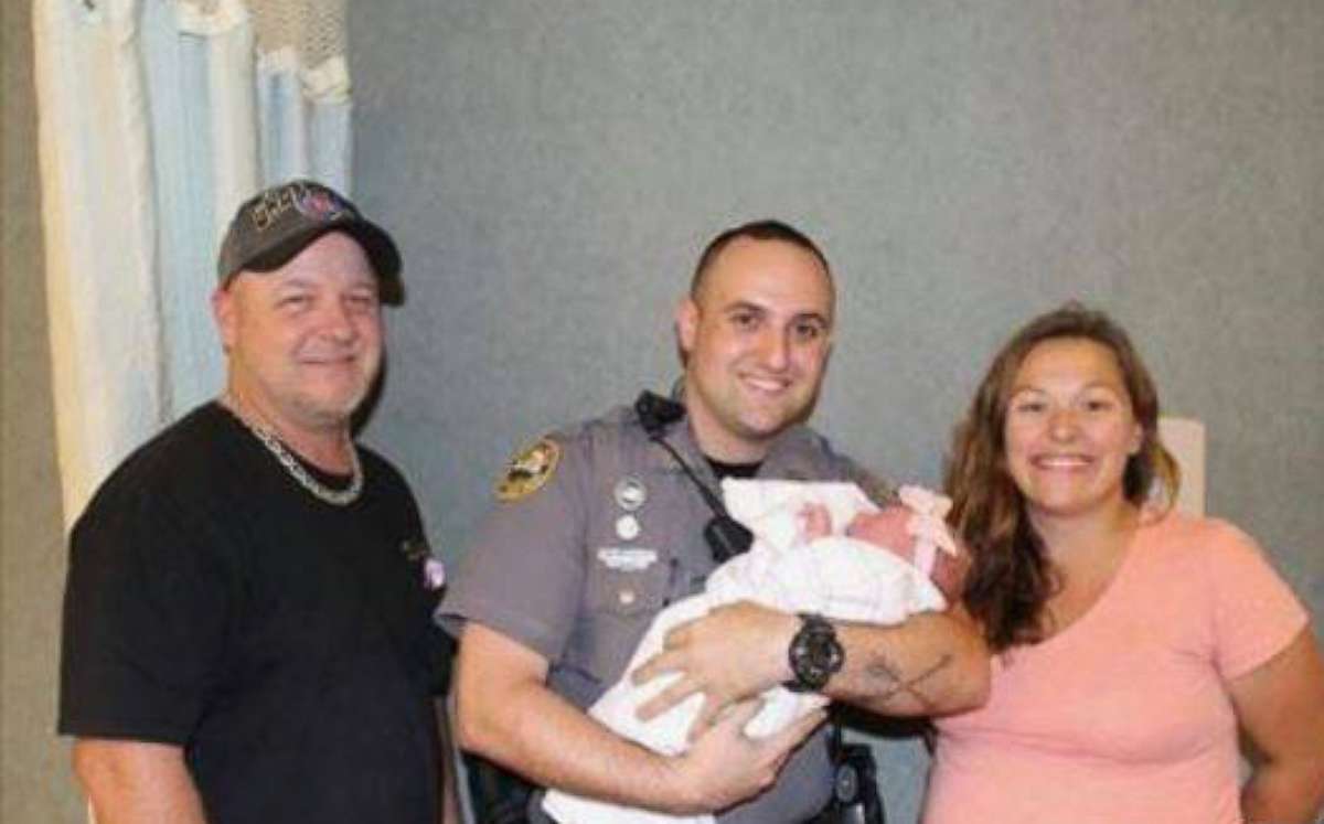 PHOTO: Daytona Beach Police Officer Robert Mowery, along with four other officers, stopped traffic Wednesday evening so that Richie Kumm, and his lovely and very pregnant wife Casidhe Kennedy, could get to Halifax after her water broke.