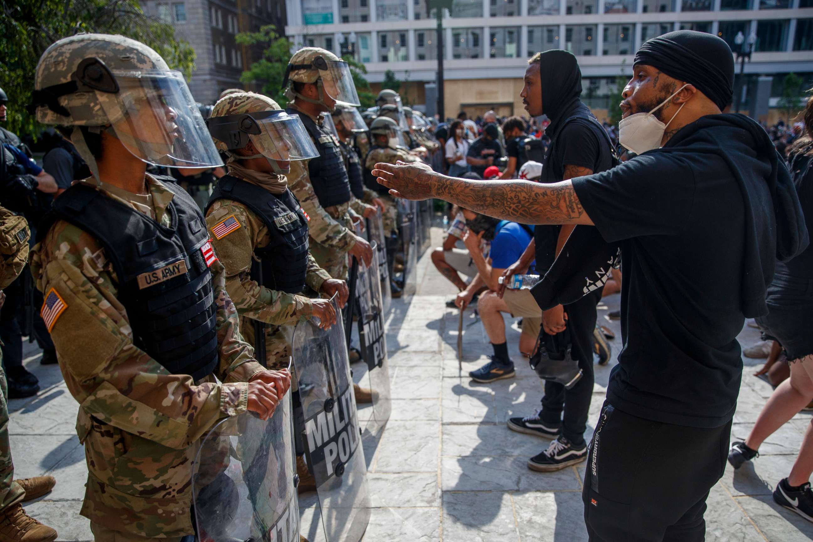 PHOTO: People gathered in protest of the death of George Floyd talk to members of the DC National Guard near the White House in Washington, D.C., June 3, 2020.