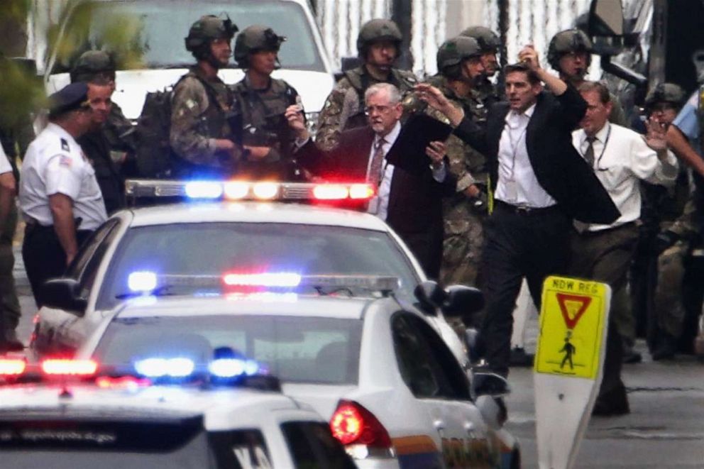 PHOTO: People come out from a building with their hands up after a shooting happened at the Washington Navy Yard on Sept. 16, 2013 in Washington, D.C.