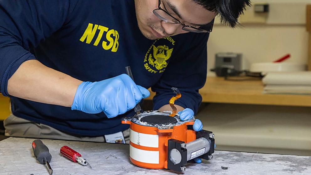 PHOTO: National Transportation Safety Board investigators examine cockpit voice recorder and flight data recorder recovered from the American Airlines passenger jet that crashed with an Army helicopter Wednesday night near Washington, Jan.30, 2024.