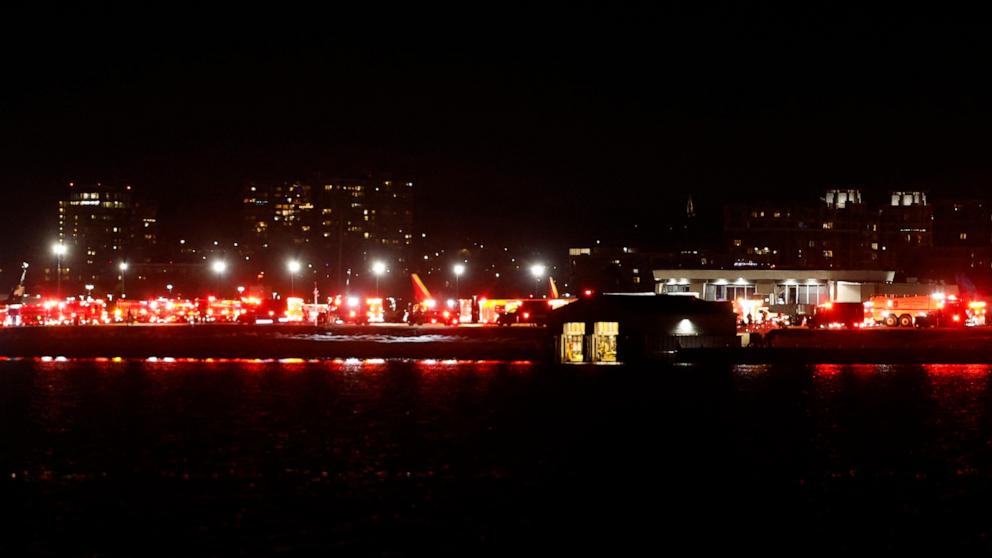 PHOTO: Lights from emergency vehicles are seen at Reagan National Airport in Washington, DC, after an air crash near the Potomac River on Jan. 29, 2025.