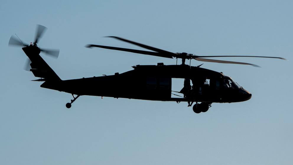 PHOTO: A U.S. Army Sikorsky UH-60 Black Hawk helicopter flies along the coast, Nov. 8, 2024, in Laguna Beach, Calif. 