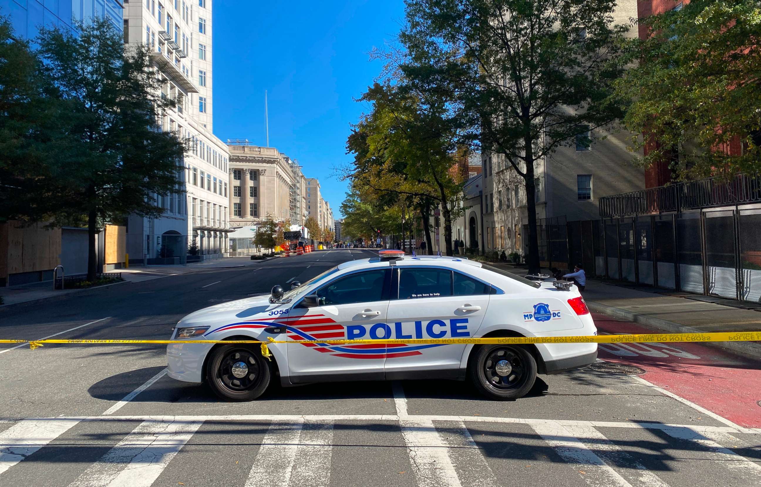PHOTO: A police car patrols at an empty H street, NW near the White House, Nov. 4, 2020, in Washington, DC.