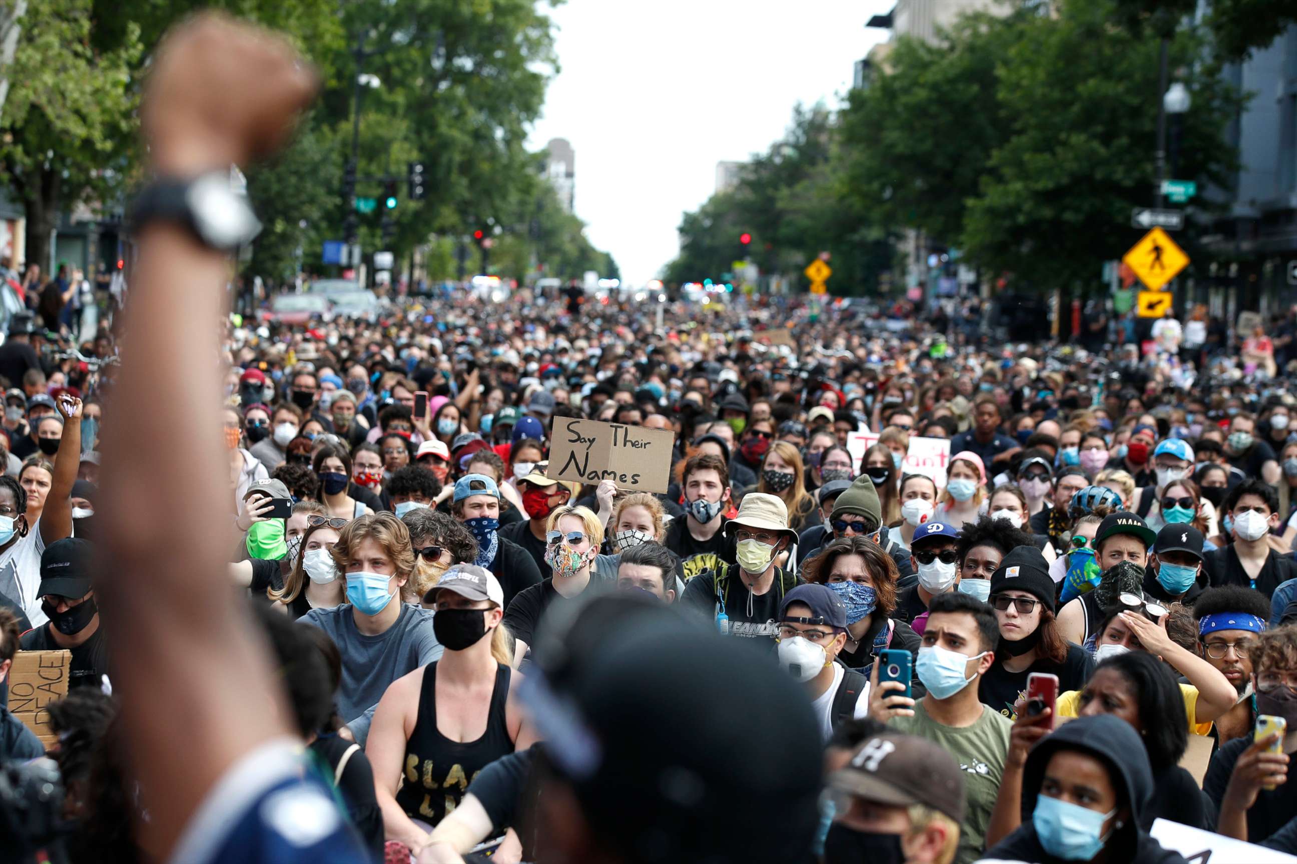 PHOTO: Demonstrators pause to kneel as they march in protest over the death of George Floyd, June 2, 2020, in Washington, D.C. 