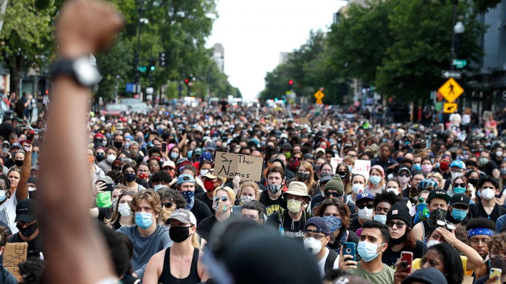 PHOTO: Demonstrators pause to kneel as they march in protest over the death of George Floyd, June 2, 2020, in Washington, D.C. 