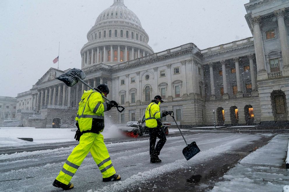 PHOTO: Workers clear the East Plaza of the Capitol as a winter storm delivers heavy snow in Washington, D.C., Jan. 3, 2022.