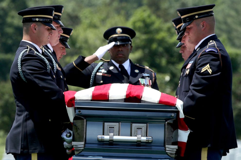PHOTO: Members of the U.S. Army's 3rd Infantry Regiment carry the flag-draped casket of World War II Army veteran Carl Mann to his final resting place during his funeral, June 6, 2019, at Arlington National Cemetery in Virginia.