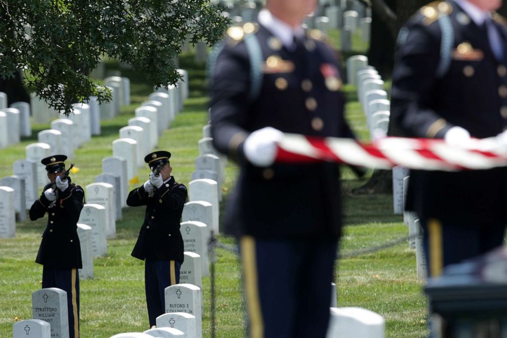 PHOTO: Members of a firing party fire shots during the funeral of World War II Army veteran Carl Mann on the 75th anniversary of the D-Day invasion, June 6, 2019, at Arlington National Cemetery in Arlington, Virginia.