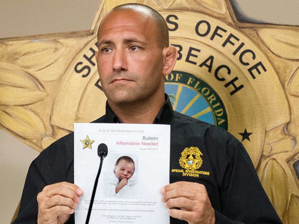 PHOTO: Special Investigations Unit Captain Steven Strivelli holds up an artist's sketch of a baby found floating on the ocean side of the Boynton Beach Inlet, in West Palm Beach, Fla., June 4, 2018.